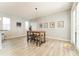 Dining area with breakfast table and chairs, light gray walls, and sliding doors to outdoor area at 14563 Bahama Swallow Blvd, Winter Garden, FL 34787