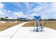 Outdoor exercise equipment accessible via paved path at the community park at 14563 Bahama Swallow Blvd, Winter Garden, FL 34787