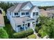 Charming two-story home with white exterior, black shutters, and a cozy front porch at 14563 Bahama Swallow Blvd, Winter Garden, FL 34787