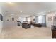 Large loft with gray sofas, neutral carpet, and stylish decor at 14563 Bahama Swallow Blvd, Winter Garden, FL 34787