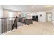 Spacious loft area with neutral carpet and a comfortable gray sofa at 14563 Bahama Swallow Blvd, Winter Garden, FL 34787