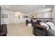 Spacious loft area with neutral carpet and comfortable gray sofas at 14563 Bahama Swallow Blvd, Winter Garden, FL 34787