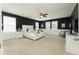 Stylish main bedroom with white furniture, carpet, and ample natural light at 14563 Bahama Swallow Blvd, Winter Garden, FL 34787