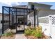 View of the screen patio with outdoor seating and hanging chair at 14563 Bahama Swallow Blvd, Winter Garden, FL 34787