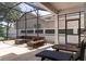 Spacious screened patio with comfortable seating, ideal for enjoying the outdoors in a pest-free environment at 14563 Bahama Swallow Blvd, Winter Garden, FL 34787