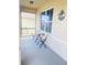 Covered front porch with a seating area to create a welcoming outdoor space to relax in at 159 Lazy Willow Dr, Davenport, FL 33897