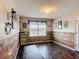 Home office features wood paneling, neutral paint, and natural light at 159 Lazy Willow Dr, Davenport, FL 33897