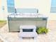 Hot tub with steps situated on a brick patio for relaxing, with lush planter nearby at 159 Lazy Willow Dr, Davenport, FL 33897