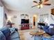 Comfortable living room with matching sofas, ceiling fan, and plenty of natural light at 159 Lazy Willow Dr, Davenport, FL 33897