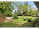 Spacious backyard with mature trees, lush greenery and ample room for outdoor activities at 2013 Pineway Dr, Orlando, FL 32839