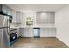 Modern kitchen featuring sleek countertops, stylish cabinets, and stainless steel appliances at 2013 Pineway Dr, Orlando, FL 32839