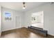 Spacious room featuring hardwood floors, a bright window, and an open doorway into another room at 2013 Pineway Dr, Orlando, FL 32839