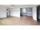 Open-concept living space featuring hardwood floors and an abundance of natural light from a large window at 2013 Pineway Dr, Orlando, FL 32839
