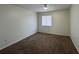 Bedroom with a window with blinds and carpeted floor at 568 Bahia Cir # B, Ocala, FL 34472