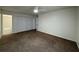 A bright bedroom featuring a ceiling fan, closet and connected bathroom with tub at 568 Bahia Cir # B, Ocala, FL 34472