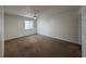 Bedroom with carpeted floor, a window with blinds, and a ceiling fan at 568 Bahia Cir # B, Ocala, FL 34472