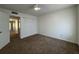 A bright bedroom with a ceiling fan, carpeted floors, and a double door closet at 568 Bahia Cir # B, Ocala, FL 34472