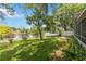 Spacious backyard with a lush lawn and waterfront view at 13219 Meadowlark Ln, Orlando, FL 32828