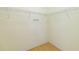 Empty walk-in closet with wood flooring and wire shelving to maximize storage space at 13219 Meadowlark Ln, Orlando, FL 32828
