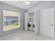 Bright laundry area with included washer and dryer, tile flooring, and natural light at 13219 Meadowlark Ln, Orlando, FL 32828