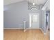 Bright living room with high ceilings, modern gray walls, and light wood flooring and a decorative front door at 13219 Meadowlark Ln, Orlando, FL 32828