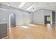 Bright living room with skylights, high ceilings, modern gray walls, and light wood flooring at 13219 Meadowlark Ln, Orlando, FL 32828