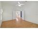 Spacious living room with wood-look flooring and open view to the kitchen at 13219 Meadowlark Ln, Orlando, FL 32828