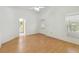 Spacious main bedroom with wood-look flooring and an en-suite bathroom at 13219 Meadowlark Ln, Orlando, FL 32828