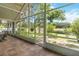 Screened lanai overlooks backyard with pond view, offering serene outdoor living and entertaining space at 13219 Meadowlark Ln, Orlando, FL 32828
