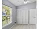Well-lit room with a closet and a large window providing natural light and a view to the outside at 13219 Meadowlark Ln, Orlando, FL 32828