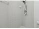 Close-up of tiled shower stall with black shower head and tile detailing at 13219 Meadowlark Ln, Orlando, FL 32828