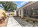 Serene backyard with paved patio and lush landscaping, perfect for outdoor living at 640 Lake Dexter Cir, Winter Haven, FL 33884