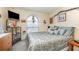 A bedroom featuring a patterned bedspread, lots of natural light, and neutral decor at 640 Lake Dexter Cir, Winter Haven, FL 33884