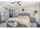 A primary bedroom featuring a large bed, soft lighting, and neutral colors at 640 Lake Dexter Cir, Winter Haven, FL 33884