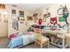 Bright bedroom featuring superhero-themed decor, study space, and comfortable furnishings at 640 Lake Dexter Cir, Winter Haven, FL 33884