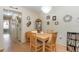 Inviting dining area with a wooden table set, chandelier lighting, and easy access to the kitchen at 640 Lake Dexter Cir, Winter Haven, FL 33884