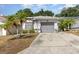 Charming single-story home featuring a well-maintained yard and a two-car attached garage at 640 Lake Dexter Cir, Winter Haven, FL 33884
