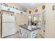 An eat-in kitchen featuring a prep island, storage, a large window, and lots of natural light at 640 Lake Dexter Cir, Winter Haven, FL 33884