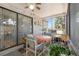 Relaxing screened lanai with ceiling fan and comfortable seating area, with a view of the garden at 640 Lake Dexter Cir, Winter Haven, FL 33884