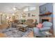 Bright living room featuring high ceilings, a fireplace, and comfortable seating arrangement at 640 Lake Dexter Cir, Winter Haven, FL 33884
