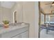 Bathroom with granite vanity and outdoor seating area access at 7634 Oakmoss Loop, Davenport, FL 33837