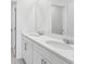 Bathroom featuring a double vanity with elegant fixtures, ample storage, and a bright, clean design at 2530 Linda Knoll Ln, Bartow, FL 33830