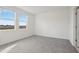 Bright bedroom with large windows, gray carpeting, and soft walls, creating a comfortable and inviting space at 2530 Linda Knoll Ln, Bartow, FL 33830