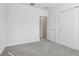 Cozy bedroom with a neutral carpet, closet, and ample space at 2530 Linda Knoll Ln, Bartow, FL 33830