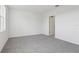 Bedroom offers neutral gray carpeting and light walls, with natural light coming in through a window at 2530 Linda Knoll Ln, Bartow, FL 33830