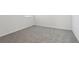 Bedroom with light gray carpet and white trim, showcasing a serene space at 2530 Linda Knoll Ln, Bartow, FL 33830
