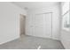 This bedroom offers a neutral carpet, closet, and bright window at 2530 Linda Knoll Ln, Bartow, FL 33830