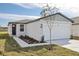 Charming single-story home with a pristine white garage door and a freshly landscaped front yard at 2530 Linda Knoll Ln, Bartow, FL 33830