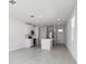 The modern kitchen features stainless steel appliances, white cabinets and a center island at 2530 Linda Knoll Ln, Bartow, FL 33830
