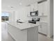 Bright kitchen features a large island with a sink and stainless steel appliances at 2530 Linda Knoll Ln, Bartow, FL 33830